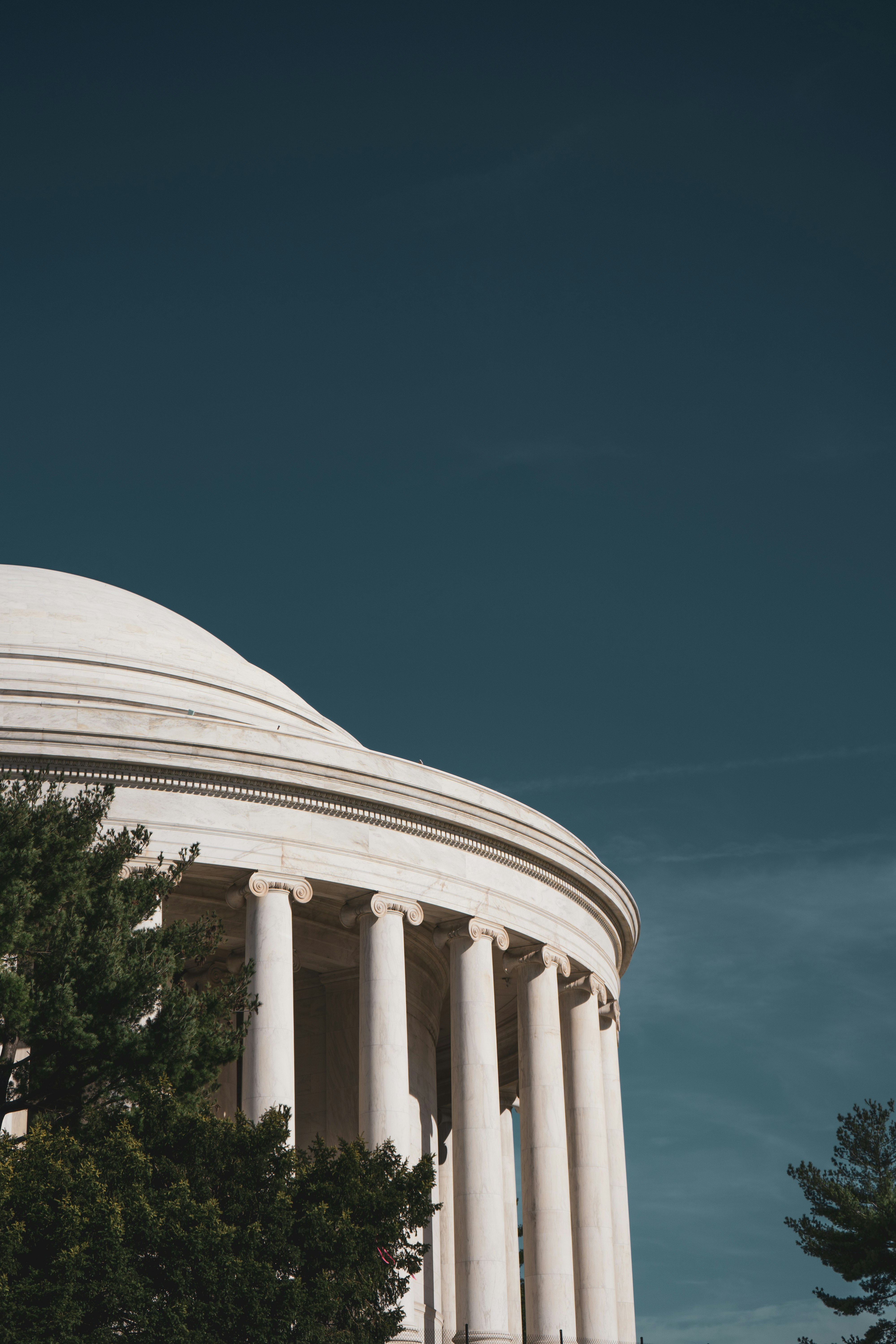 white concrete building under blue sky during daytime